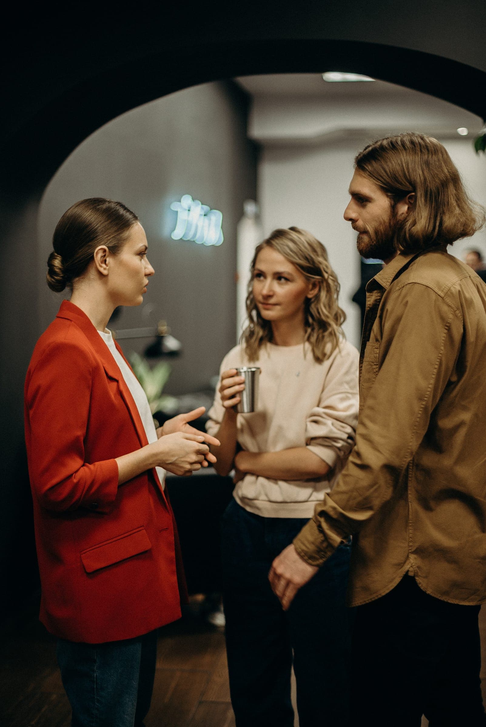Three colleagues talking in the office